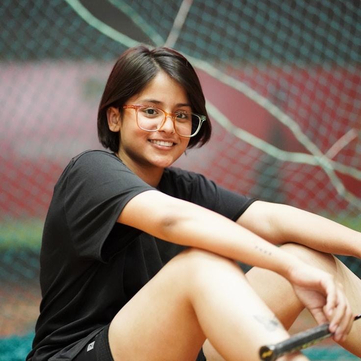 Kaveri Mehta, Lead Design Curator at Quiet Ocean Platform, reviewing corporate floral arrangements